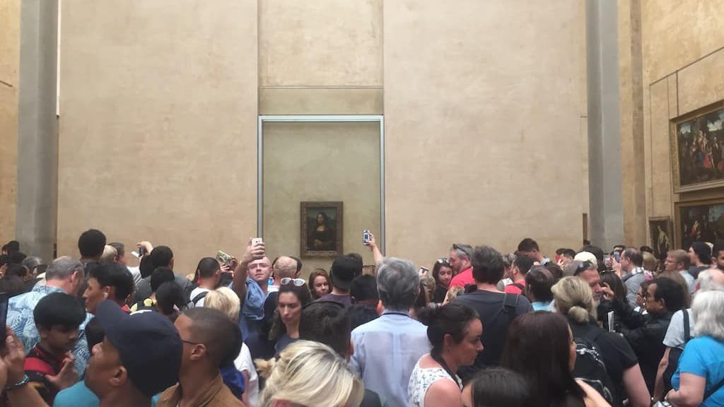 People visiting the Louvre museum in Paris