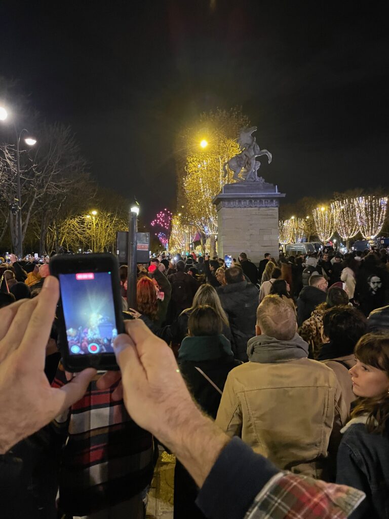 People gathered on the crowded Champs Elysée for New Year's Eve